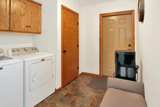 Laundry mudroom off the garage with cabinet space and an oversized coat closet..jpg