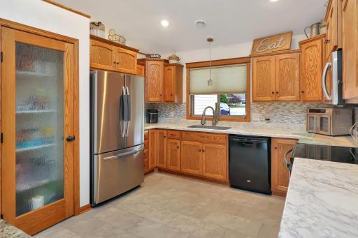 New stainless steel fridge, large pantry, and tons of cabinet space.jpg