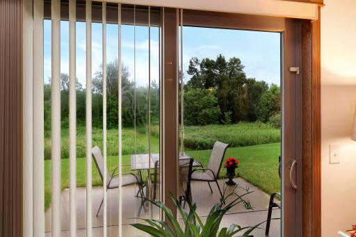 Patio door off the living room- peaceful setting!.jpg