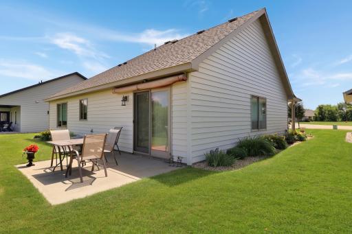 Patio area off the living room with an awning to enjoy the warm summer days, and beautiful sunsets!.jpg