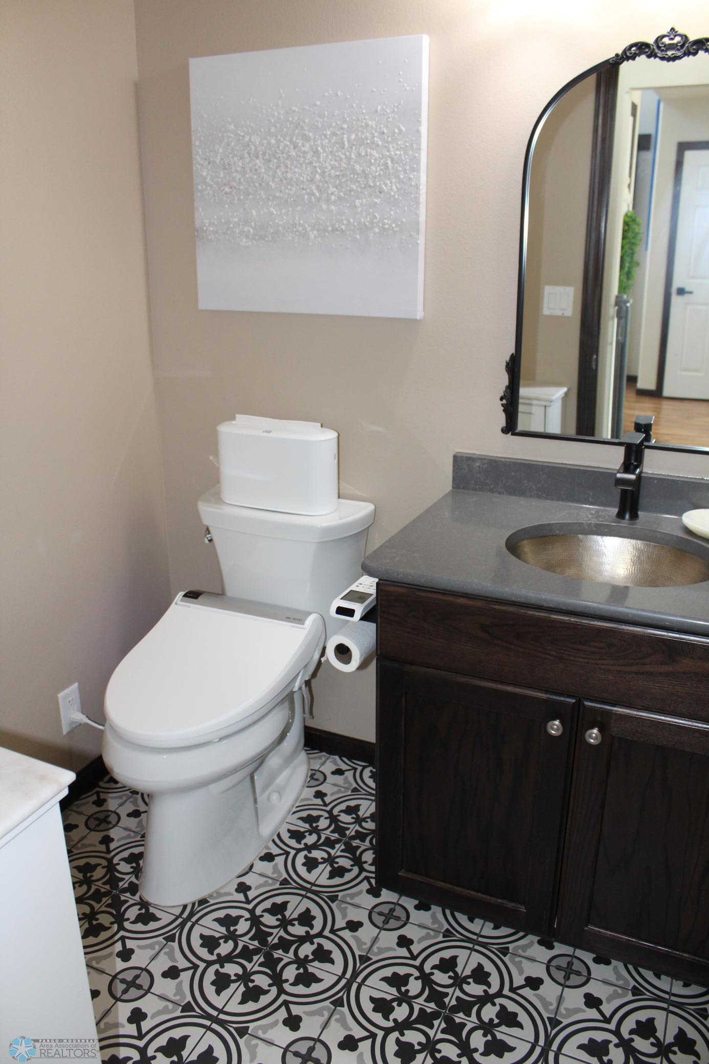 Main floor 1/2 bath-updated sink/counter/floor