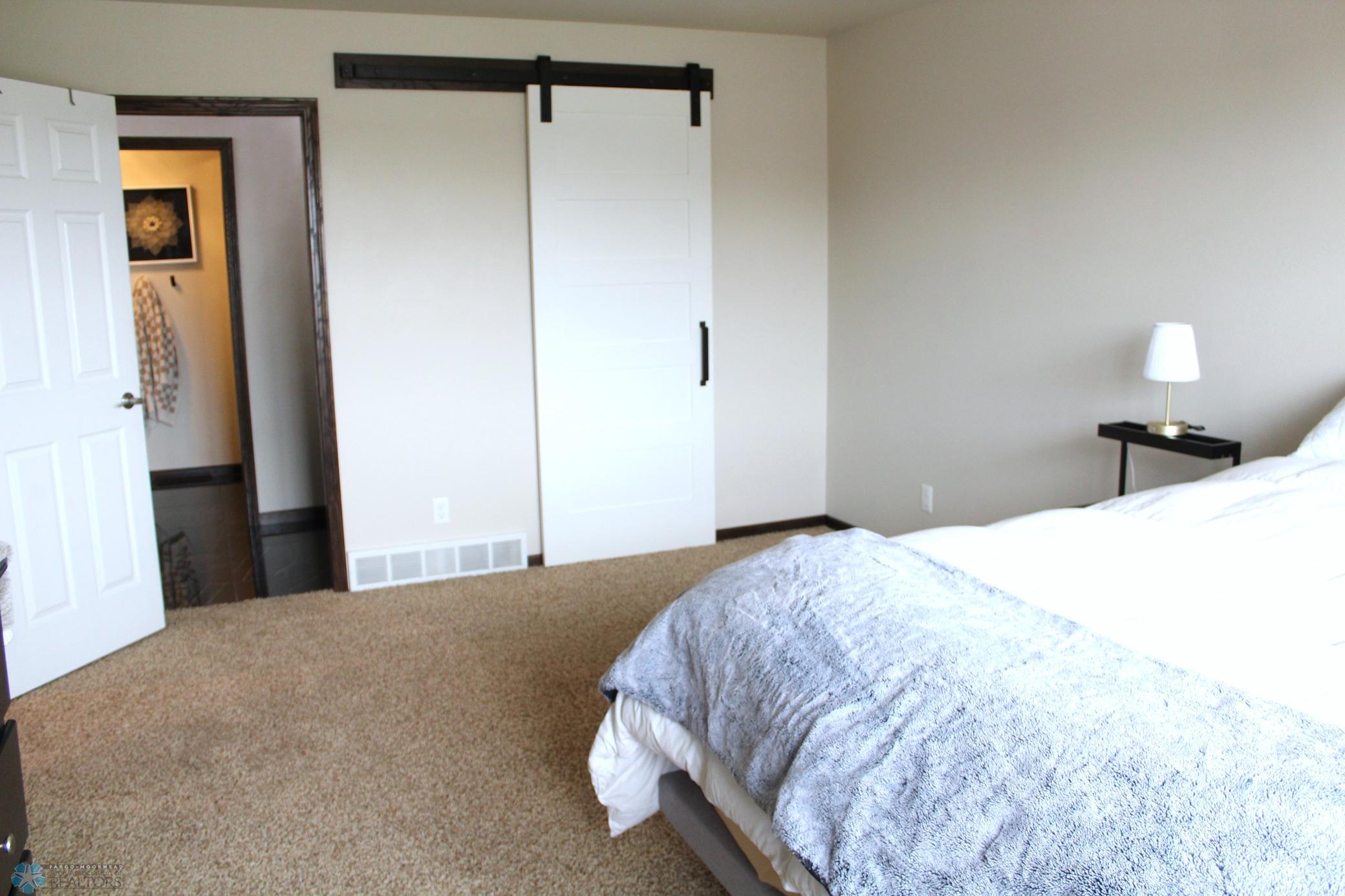 Huge primary suite-barn door to WIC