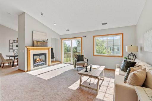 Living room with gas fireplace and lots of natural light