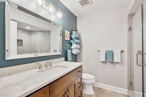 A 3/4 Bathroom is perfect for cleaning up after spending time in the pool. This bathroom features a comfort height-vanity and tiled shower.