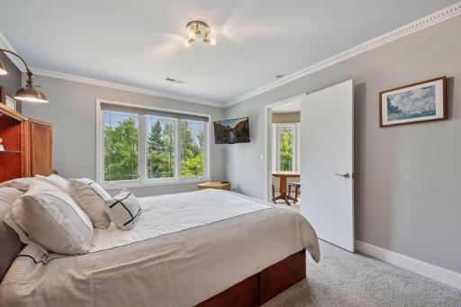 The second bedroom suite overlooks the front yard and treetop.