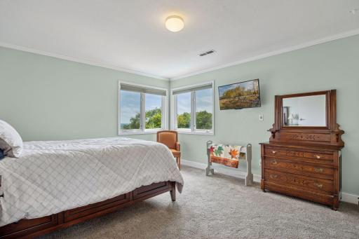 The upper level houses two bedroom suites - this room features a walk-in closet and long views over the bluffs and valley.