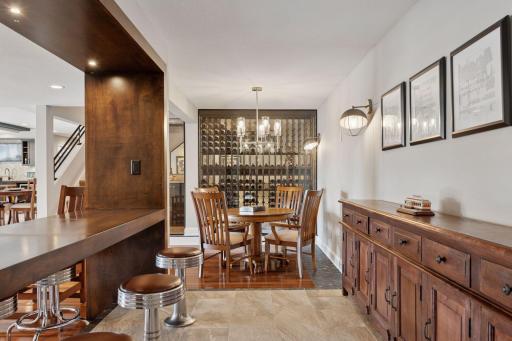Vintage barstools provide a place to relax while watching the billiards game.