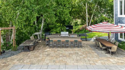 The outdoor Kitchen is equipped with a Grill Lion gas grill - with a plumbed gas line - and a beverage refrigerator. There is plenty of room to gather with friends and family out here!