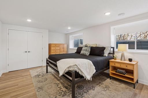 Head down to the lower level to discocer the large lakeside bedroom