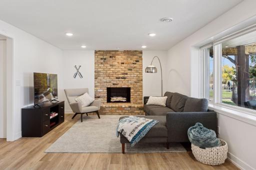Great lower level hangout spot with wood burning fireplace and lake views