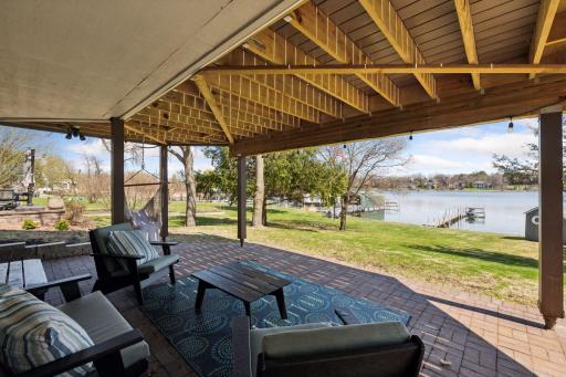 The large patio offers a shady spot to relax and enjoy the lakeside views