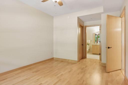 Primary bedroom with private bath and custom built-out walk in closet