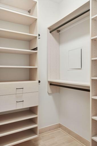 En suite walk-in closet in primary bedroom