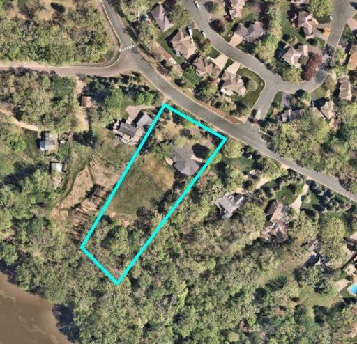 Set atop the majestic river bluffs and nestled on a breathtaking 2-acre lot, this exquisite lot offers an unmatched blend of privacy & scenery.