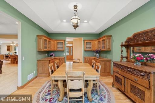 Formal dining room with cabinets and counter space - great for entertaining and serving.