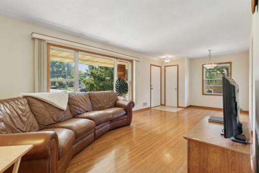 The charming front porch entry opens into the tile entry with coat closet.