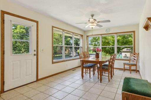 Easy access from the kitchen and dining room/sun room to the backyard patio.
