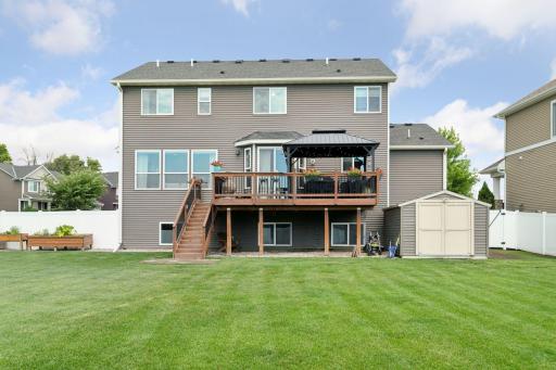 HUGE flat grassy and fenced in with 6 foot maintenance free fencing yard