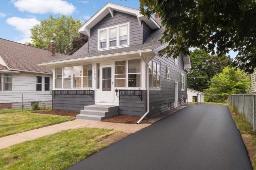 New asphalt driveway coming early August 2025; virtually staged photo.