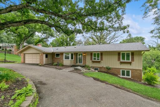 This home is on a beautiful lot with circular driveway~