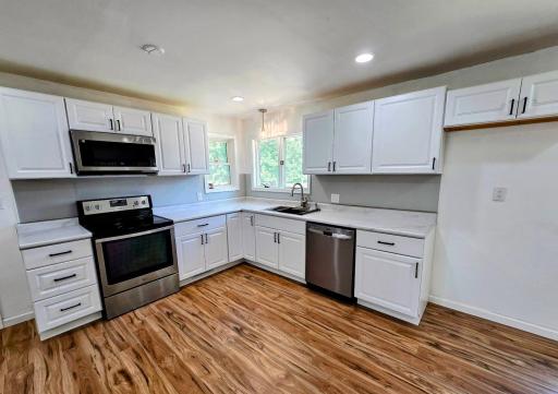 Stainless steel appliances & beautiful white cabinets