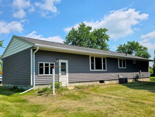 Back of house- white door is access to garage