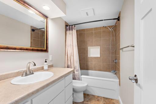 Lower level with tile floor and tile surround