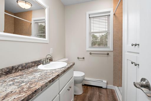 Updated 3/4 bath on main with tile surround