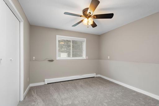Office in Lower Level with ceiling fan, new carpet and freshly painted!