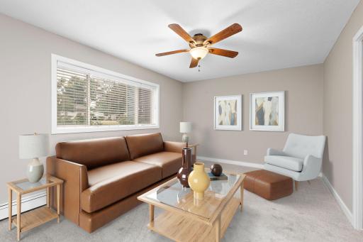 Lower Level Family Room with ceiling fan, new carpet and freshly painted! (Could be 5th bedroom if needed) - Virtually staged photo
