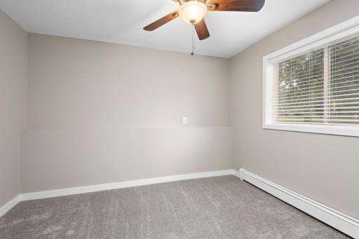 Office in Lower Level with ceiling fan, new carpet and freshly painted!