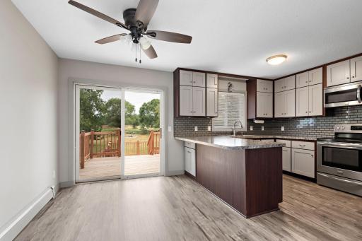 Step out of your kitchen/dining room on to your 2-tier Deck that overlooks your private back yard - also has steps to back yard and huge patio!