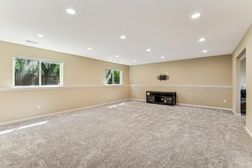 The finished lower level offers a spacious family room filled with ample recessed lighting!