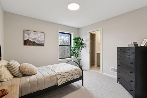 Upper level bedroom with 3/4 ensuite bath.