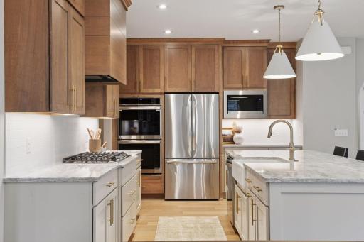 Soft close cabinet doors and drawers, under cabinet lighting, upgraded LG appliances, quartz counter tops.