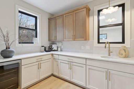 Prep kitchen with a sink, drink fridge and walk-in pantry