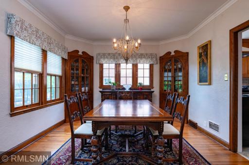 Formal dining room has two china cupboards.