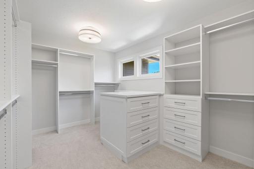 Large walk-in primary closet off bathroom