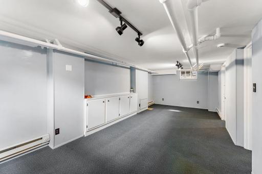 The basement boasts a large family room, perfect for movie nights with loved ones.