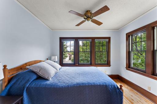 SE Bedroom upstairs. Filled with natural light from two directions. The hardwood floors are pristine - the lighting in this photo makes them look less so.