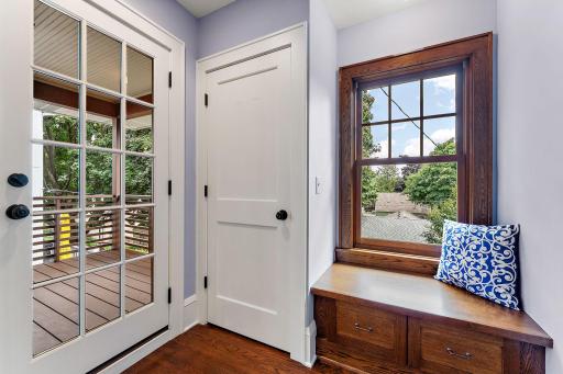 Second floor landing. Lovely bench to sit and to the left the entrance to the deck.
