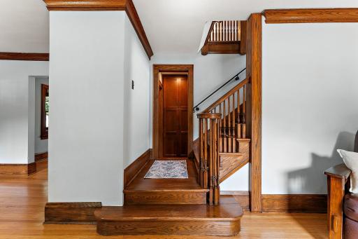 Stairs leading to the upper level with three bedrooms.