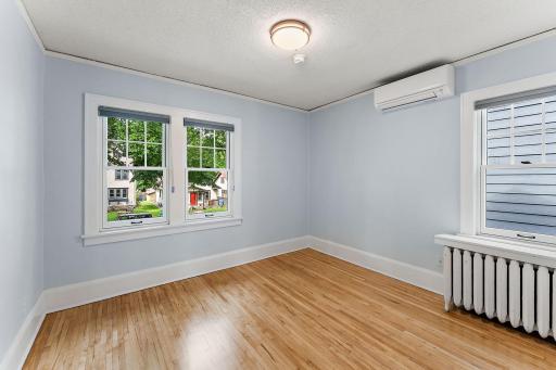NW Bedroom upstairs. Windows on both sides for lots of light.