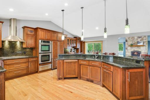 The kitchen is the heart of the home, boasting abundant cabinet space and premium stainless steel appliances.