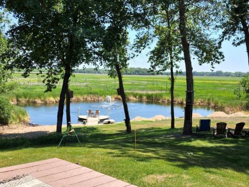 Pond with fountain, dock, sandy beach, gorgeous views