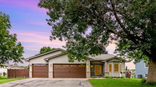 Great curb appeal with updated modern garage doors, vinyl siding and brick accents.