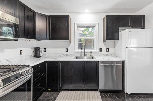 Soft close cabinetry and stainless range, microwave, and dishwasher