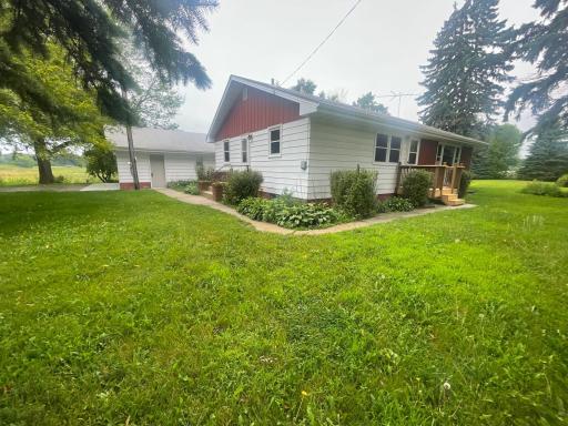 Steel siding, brand new triple pane windows, new front porch, many hostas, plants and shrubs