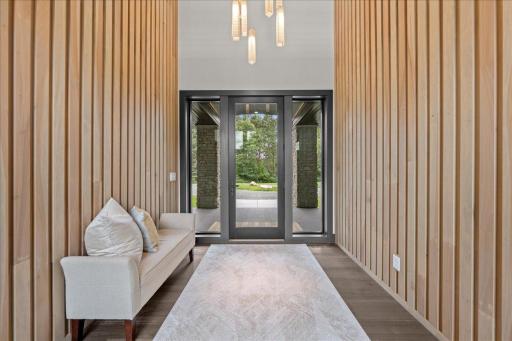 A beautiful blend of natural woods meets dark woods. The Foyer Chandelier expands two floors. You will see the full effect on site.