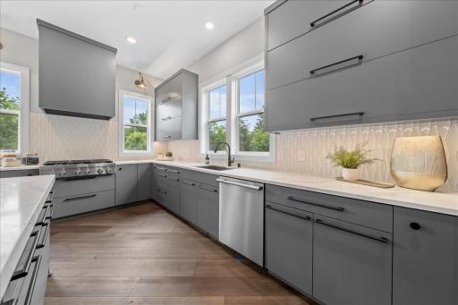 Views to the outside without compromising storage. Ample quartz counter space; every families dream